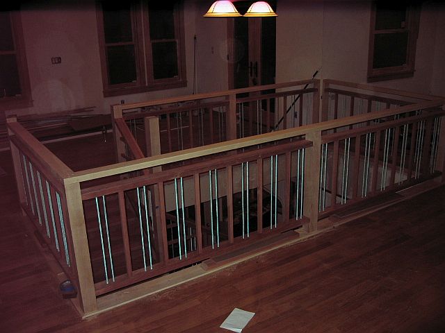 LIPTUS, MAPLE & METAL DOWEL STAIR & RAIL (view of the upper floor wrapping of posts & railing)