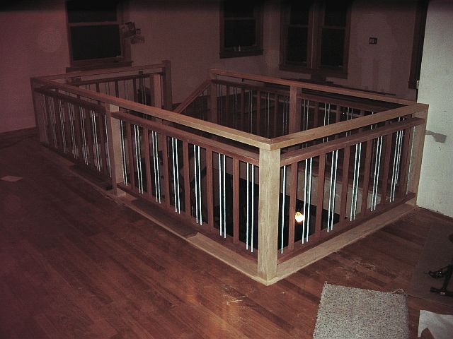 LIPTUS, MAPLE & METAL DOWEL STAIR & RAIL (view of the upper floor wrapping of posts & railing)