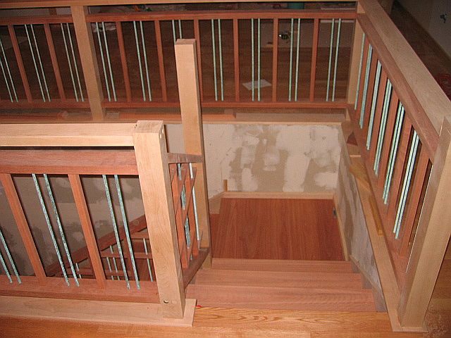 LIPTUS, MAPLE & METAL DOWEL STAIR & RAIL (downward view of the top flight, upper landing, posts & railing)